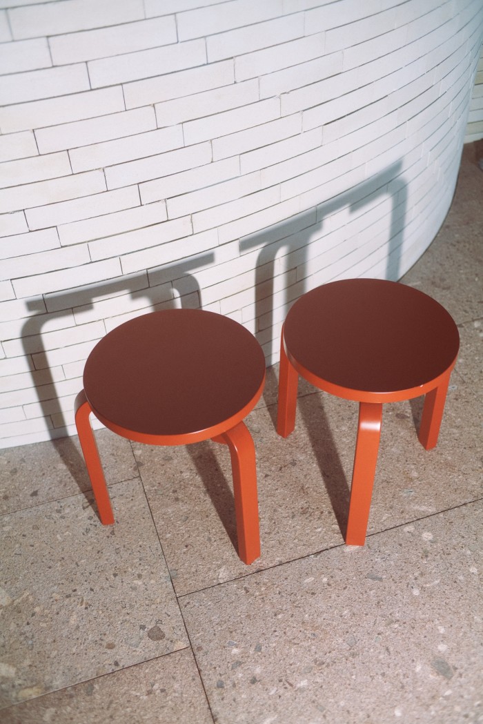 A pair of Artek 60 Stools