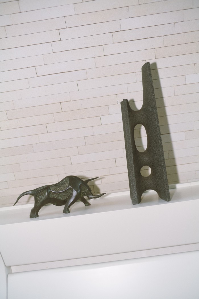 From left: a vintage Bull sculpture bought in Surry Hills and a work by Dung Ming-Lung