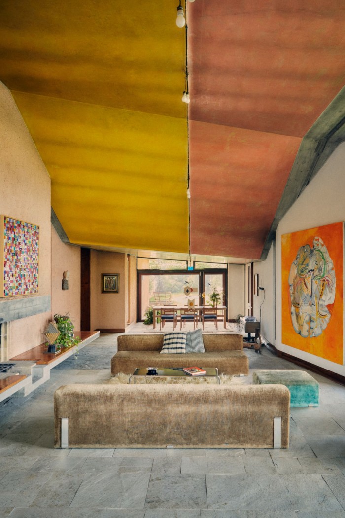 The living room at Casa Tabarelli near Bolzano, Italy, with works by Alighiero Boetti (left wall) and Martin Kippenberger (right wall)