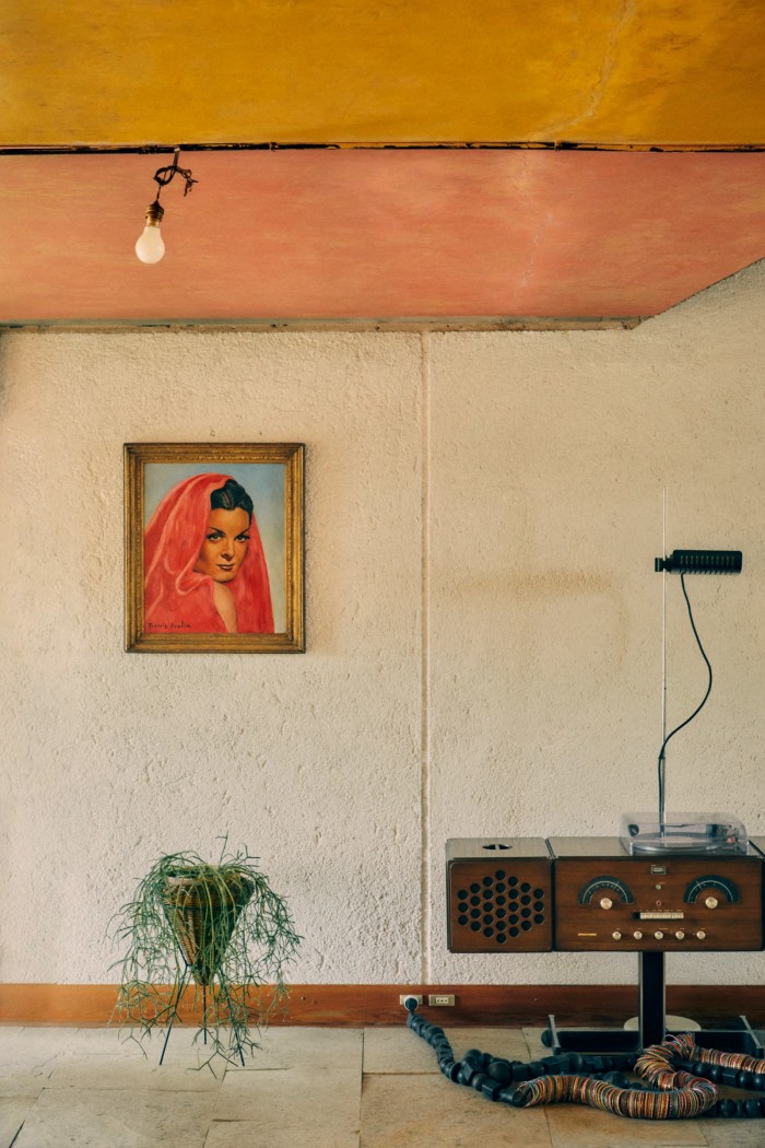 A Francis Picabia hangs by a Brionvega radio-phonograph