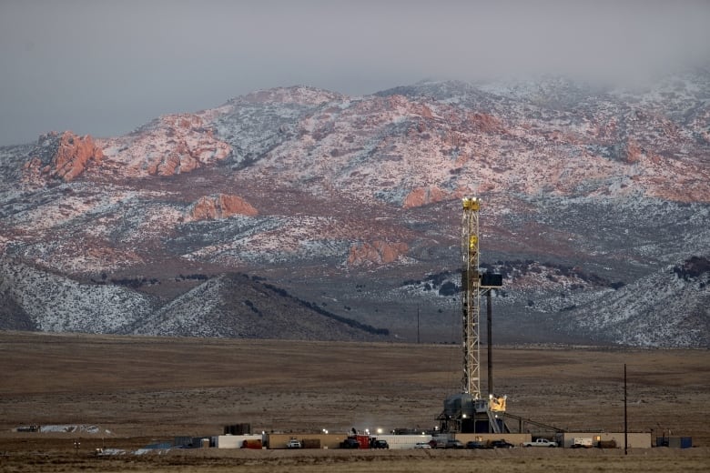 A drill rig stands at a geothermal site under construction in Utah.