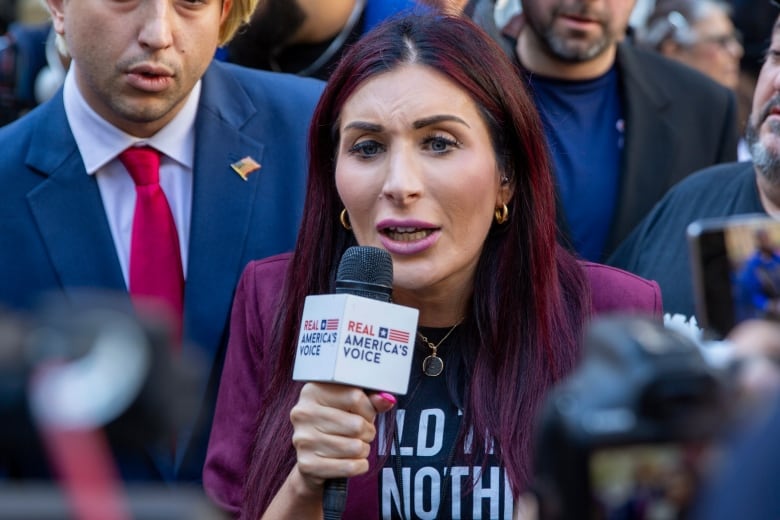 Right-wing activist Laura Loomer is in front of the courthouse where the hush-money trial of Donald Trump got underway Monday, April 15, 2024, in New York. (AP Photo/Ted Shaffrey)