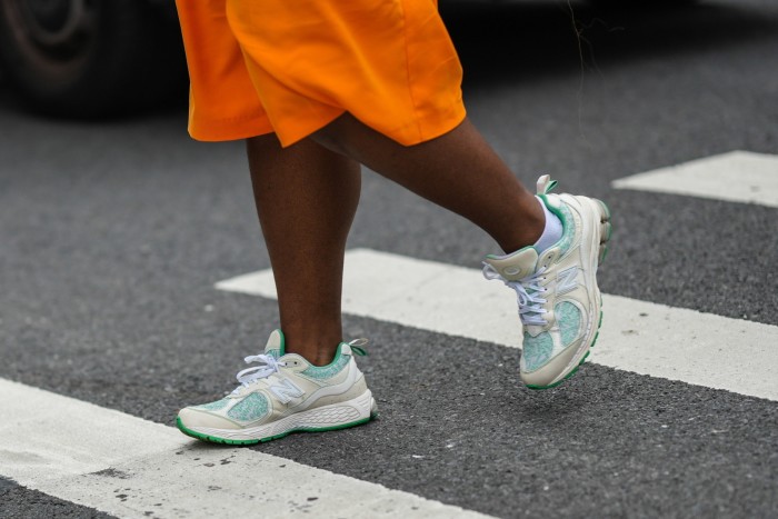 Woman’s legs seen crossing a road