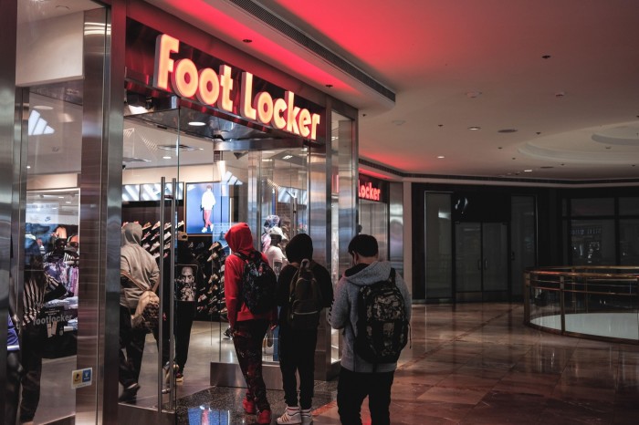 People outside a branch of Foot Locker