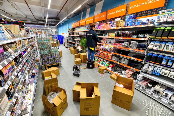 Worker inside an Action discount store