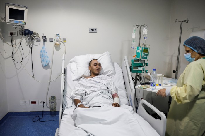 Mahmoud Dhaiwi, 23, a Lebanese army soldier who was injured during an Israeli airstrike in southern Lebanon, is hospitalised in an ICU of Geitaoui Hospital burns unit, in Beirut, 