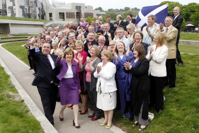 SNP leader Alex Salmond and SNP deputy leader Nicola Sturgeon with newly elected SNP MSPs outside Scottish Parliament in Edinburgh, following the SNP’s unprecedented victory in the Scottish Parliament election in 2011