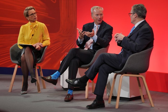 Sir Keir Starmer, right, on stage with Eric Schmidt, centre and Dame Emma Walmsley, CEO of GSK