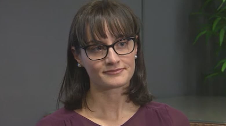 Rosella, a brunette woman with glasses, is pictured.