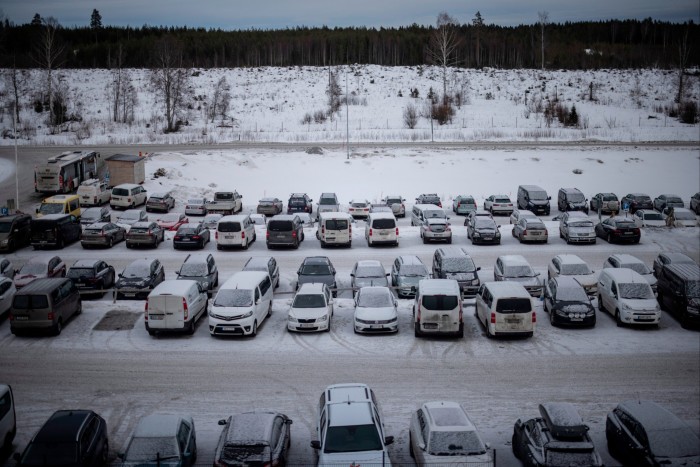 Vehicles in a snow-covered car park at the Northvolt gigafactory