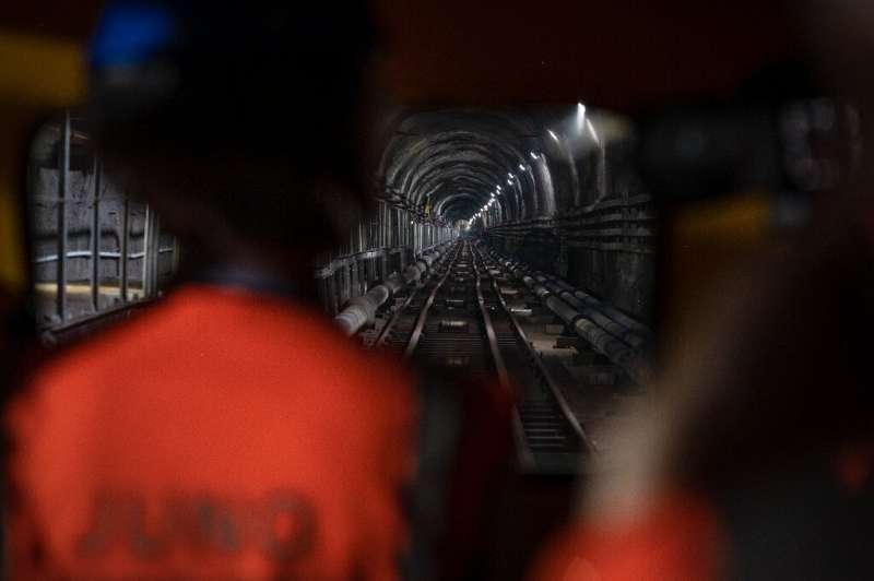 The lab is reached by a funicular train that travels down a tunnel to a cavern built 700 metres (2,300 feet) underground to limit radiation emissions