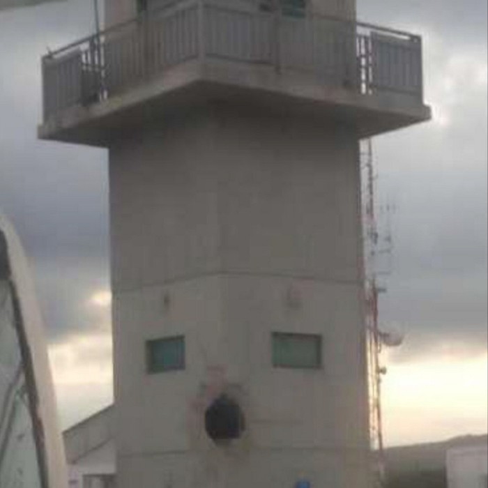 Photo of a hole in an observation tower, included in a confidential report