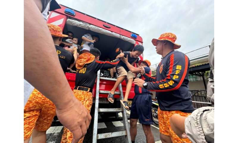 Firefighters evacuate residents in Cagayan province, north of Manila on Thursday