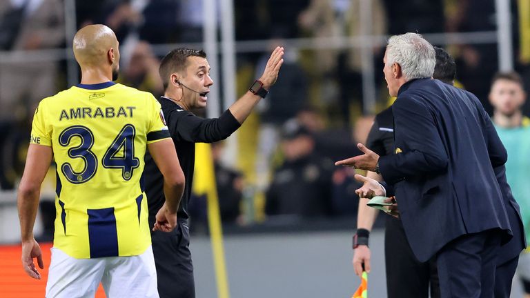 Jose Mourinho argues with referee Clement Turpin following his red card during Fenerbahce's Europa League game against Manchester United