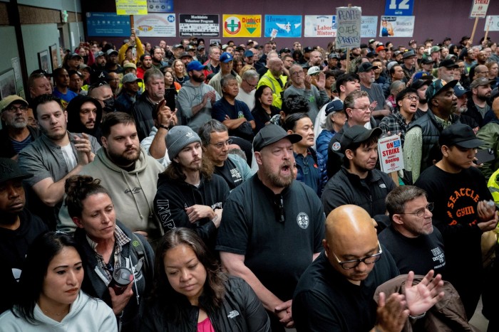 Boeing workers from the International Association of Machinists and Aerospace Workers District 751 attend a rally at their union hall during an ongoing strike in Seattle, Washington