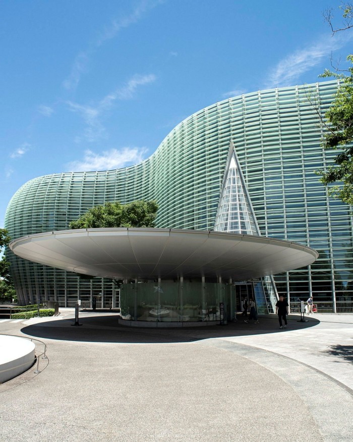 The curved-glass facades of the National Art Center, Tokyo