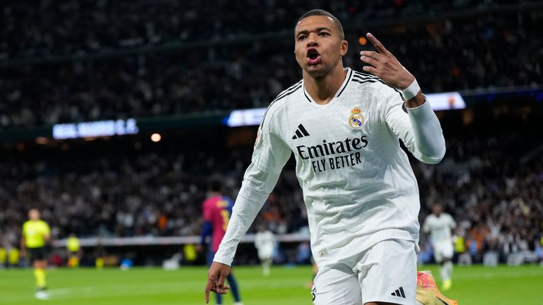 FILE - Real Madrid's Kylian Mbappe celebrates after scoring a goal which was disallowed during a Spanish La Liga soccer match between Real Madrid and Barcelona at the Santiago Bernabeu stadium in Madrid, Spain, Saturday, Oct. 26, 2024. (AP Photo/Manu Fernandez, File)