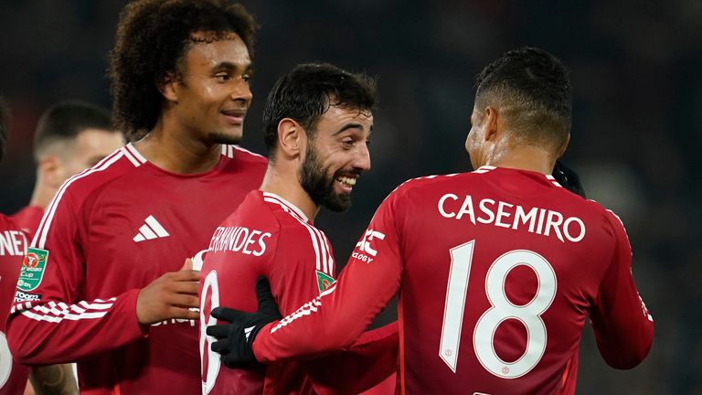 Manchester United's Bruno Fernandes celebrates with his team-mates after scoring his side's third goal (AP Photo/Dave Thompson)