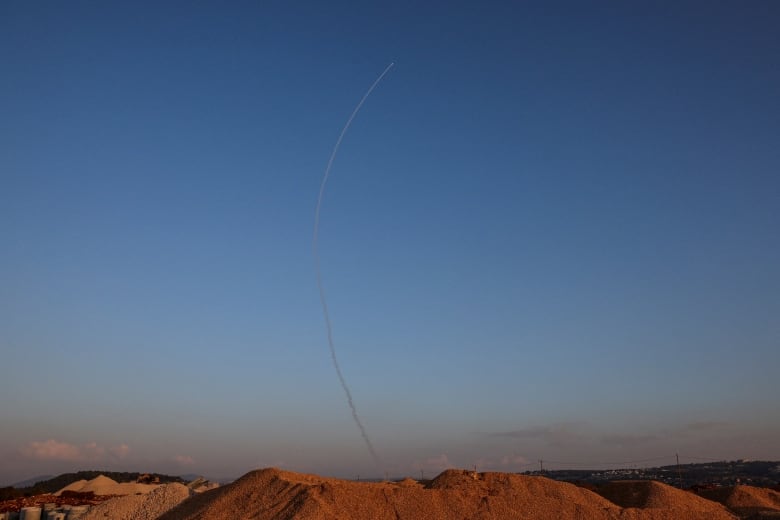 A missile gets intercepted in the sky.