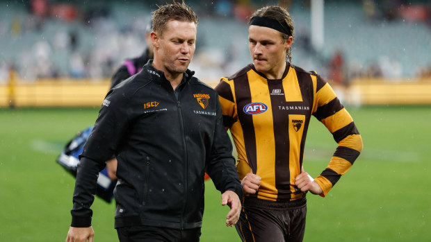 Sam Mitchell walks with Jack Ginnivan.