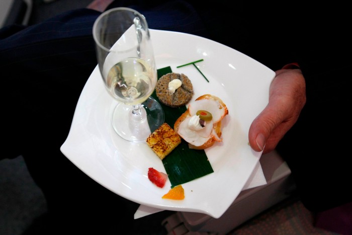 Champagne and appetisers on an Emirates jumbo jet