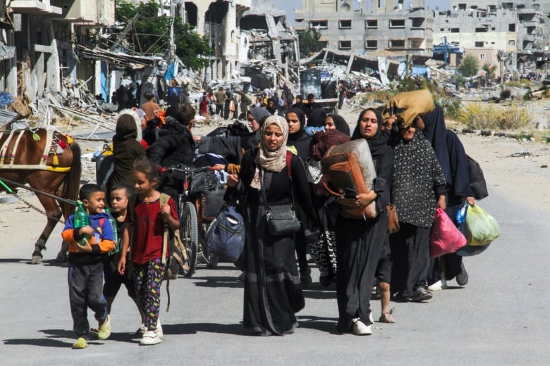 People fleeing with bags in hand.