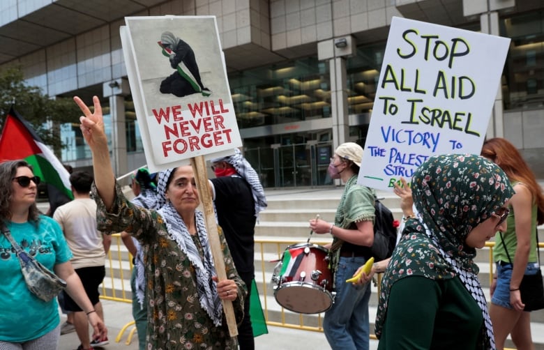 Pro-Palestinian protesters protest against the visit by U.S. President Joe Biden to downtown Detroit.