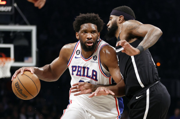 NEW YORK, NEW YORK - APRIL 20: Joel Embiid #21 of the Philadelphia 76ers dribbles against Royce O'Neale #00 of the Brooklyn Nets during the second half of Game Three of the Eastern Conference First Round Playoffs at Barclays Center on April 20, 2023 in the Brooklyn borough of New York City. The 76ers won 102-97. NOTE TO USER: User expressly acknowledges and agrees that, by downloading and or using this photograph, User is consenting to the terms and conditions of the Getty Images License Agreeme