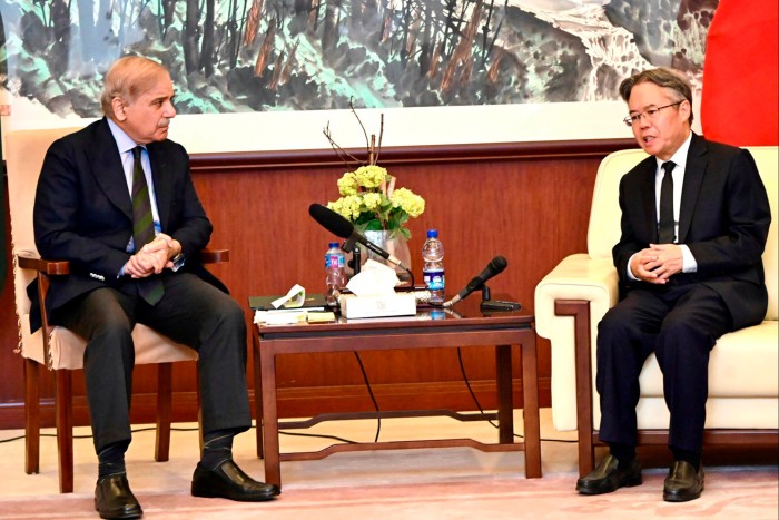 Pakistan’s Prime Minister Shehbaz Sharif, left, meet with Chinese Ambassador Jiang Zaidong