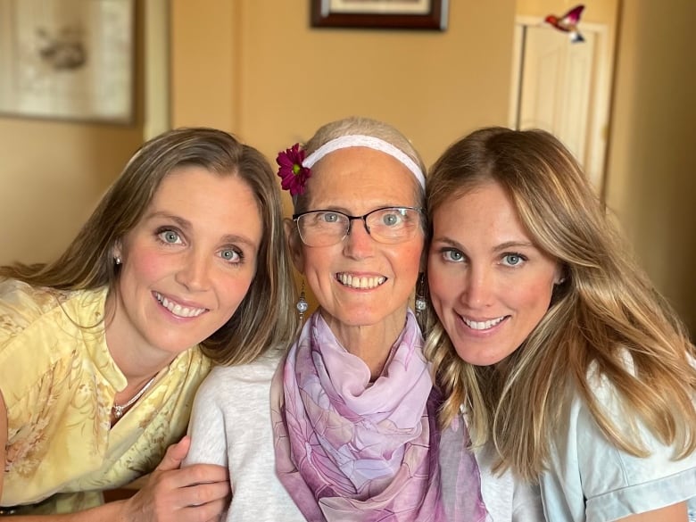 Three women smiling.