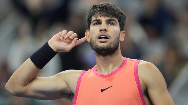 Carlos Alcaraz of Spain gestures during their men's singles finals match against Jannik Sinner of Italy at the China Open tennis tournament, National Tennis Center in Beijing, Wednesday, Oct. 2, 2024. (AP Photo/Achmad Ibrahim)