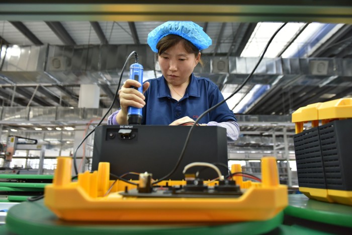 A worker at a mobile energy storage power production workshop in Fuyang, China