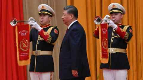 China’s President Xi Jinping walks to the podium during a reception on the eve of National Day at the Great Hall of the People in Beijing.