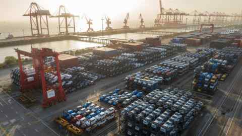 New vehicles are being loaded on to special frame transports at the International Container Terminal in Taicang Port, Suzhou, China.