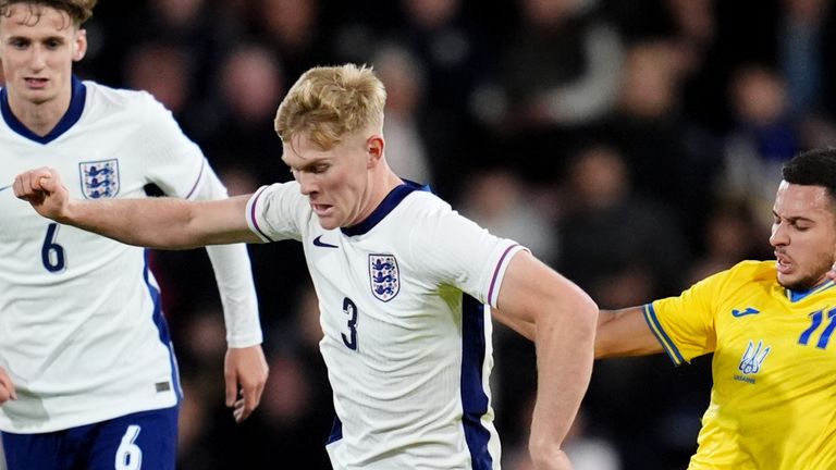 England's Lewis Hall (centre) and Ukraine's Nazar Voloshyn (right) battle for the ball during the UEFA Euro U21 Championship Qualifying Group F match at the Vitality Stadium, Bournemouth. Picture date: Friday October 11, 2024.