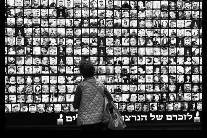 A woman looking at memorial for the Israeli victims of the October 7 attack