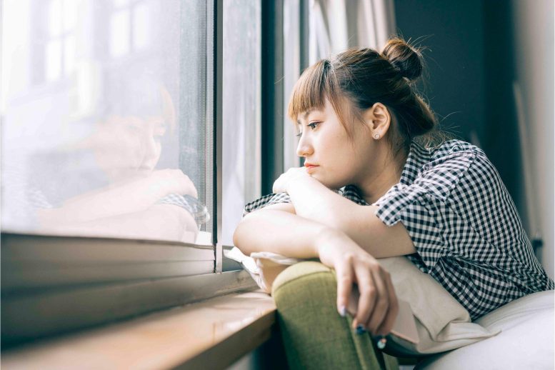 Lonely Sad Woman Looking Out Window