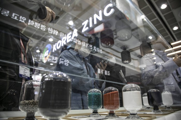 Raw materials for battery manufacturing are displayed in glass containers at the Korea Zinc booth during an exhibition in Seoul, South Korea