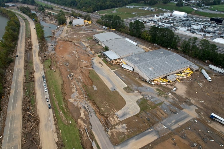 Flood damage is seen around a factory in an aerial photo.