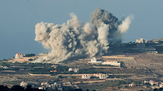 an explosion near buildings on a hull