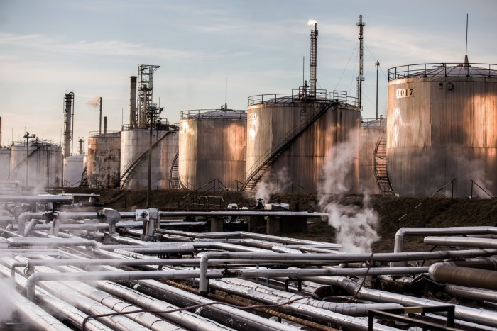 Storage tanks stand at the Duna oil refinery, operated by Mol in Szazhalombatta, Hungary