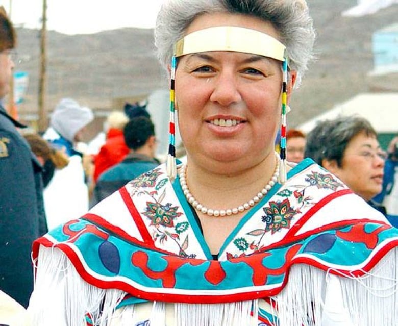 A woman in a traditional Inuk headdress