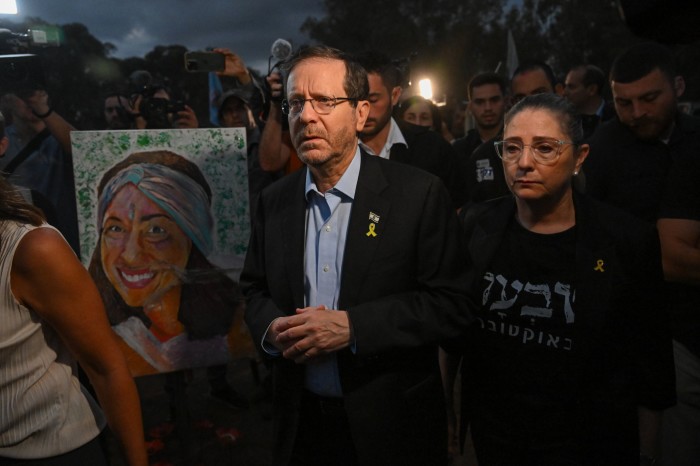 Isaac Herzog and his wife attend a memorial ceremony at the Nova festival site in Re'im, Israel, marking the first anniversary of the Hamas attacks