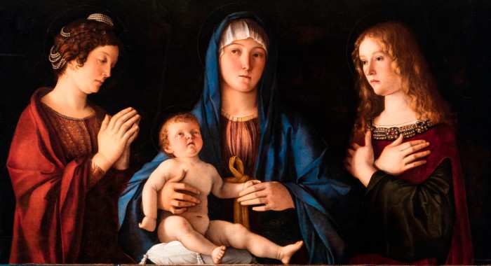 Bellini’s ‘Madonna and Child and Saints Catherine and Mary Magdalene’, with the figures against a dark background seeming to glow from within