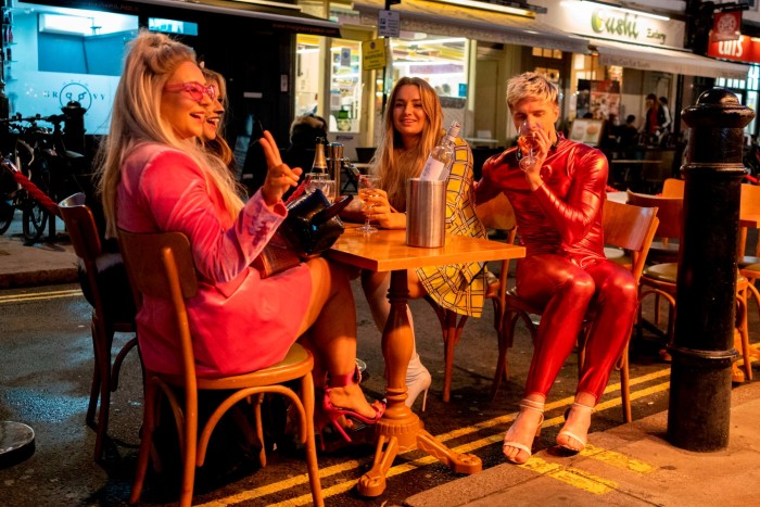 Young people drinking in Soho