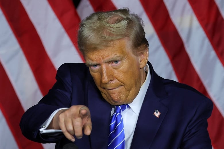 Former U.S. president Donald Trump gestures during a campaign event in Milwaukee on Tuesday, Oct. 1, 2024.