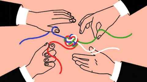 Hands holding strands of string which make up the colours of the US and Mexican flags and join together in a loose knot