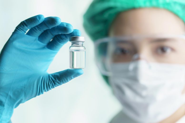 Woman Doctor Holding Vaccine Vial