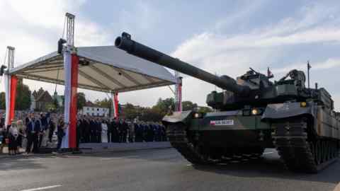 Polish soldiers in Korean-made tanks take part in a military parade in Warsaw on Armed Forces Day on August 15