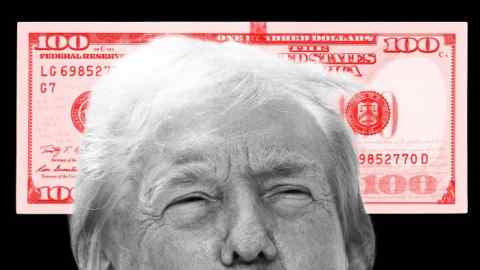 The top of Donald Trump’s head in front of a huge, red $100 bill